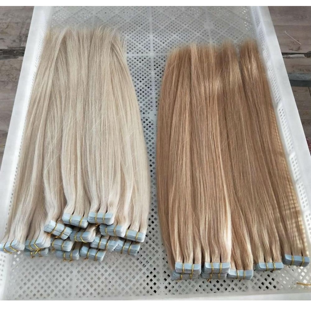 High quality tape in human hair extensions. 18” 115 grams Light Blonde #613